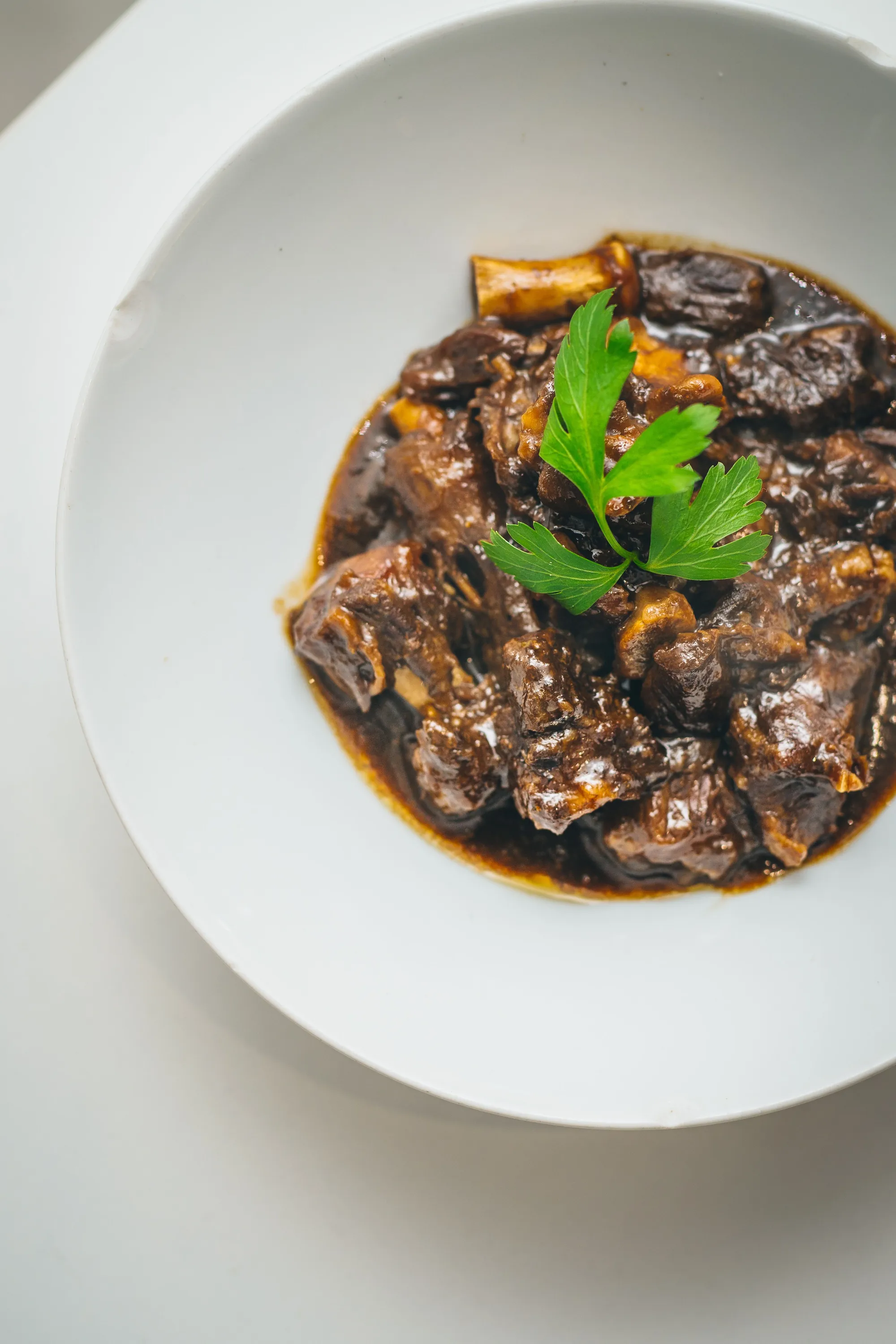 Slow-braised oxtail in rich gravy, Afro-Caribbean catering in London by Tobis Private Catering